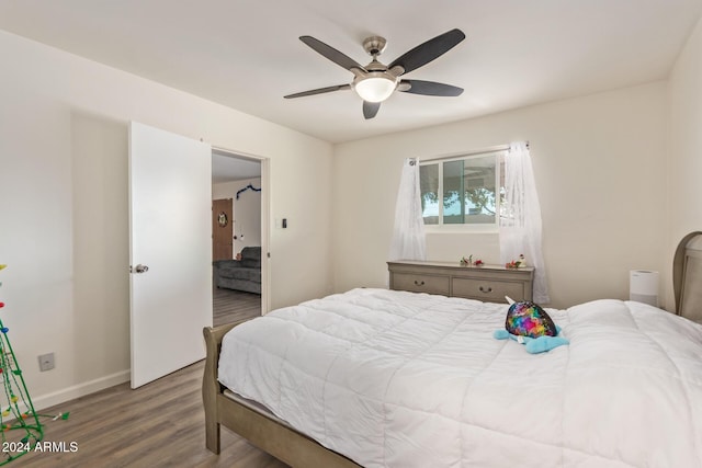 bedroom featuring hardwood / wood-style floors and ceiling fan