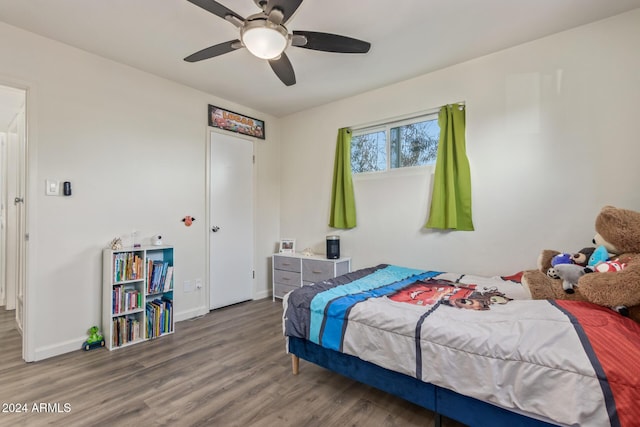 bedroom featuring ceiling fan and hardwood / wood-style floors