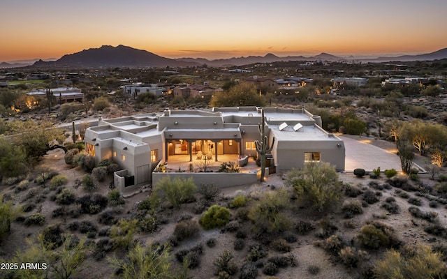 drone / aerial view featuring a mountain view