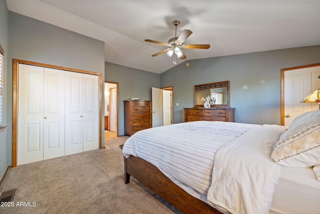 carpeted bedroom with connected bathroom, a ceiling fan, and vaulted ceiling