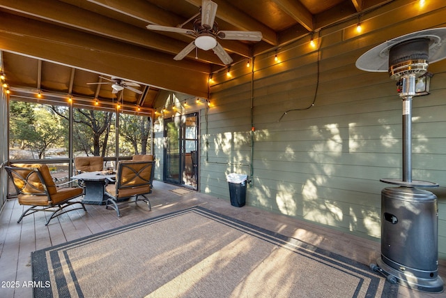 wooden deck featuring ceiling fan