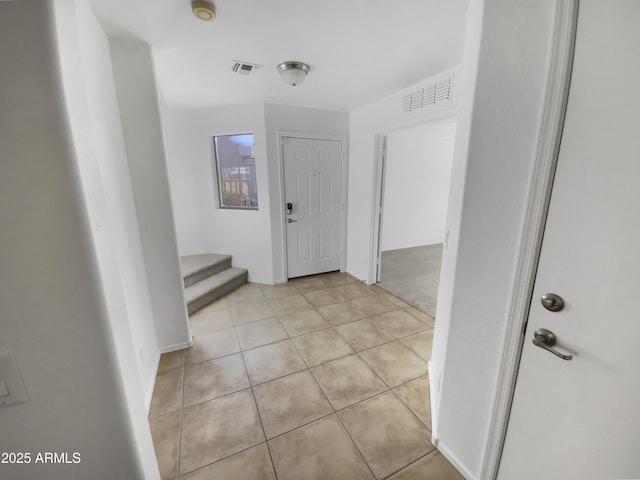 hallway with light tile patterned flooring