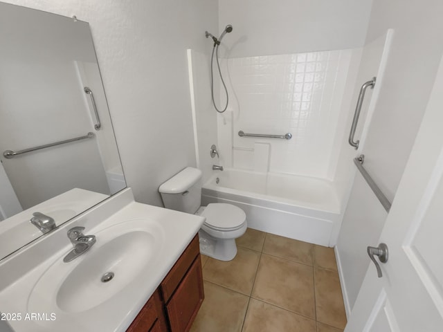 full bathroom featuring tile patterned floors, vanity, toilet, and shower / washtub combination