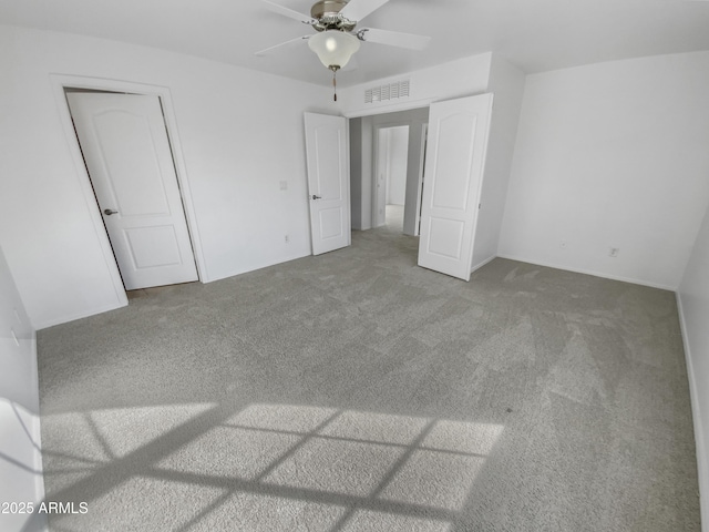 unfurnished bedroom with ceiling fan and carpet flooring