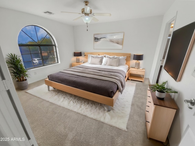 carpeted bedroom with ceiling fan