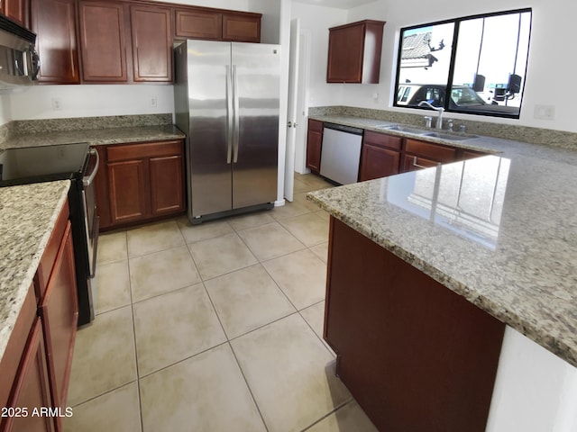 kitchen featuring light tile patterned floors, light stone countertops, sink, and stainless steel appliances