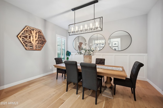 dining space with hardwood / wood-style floors