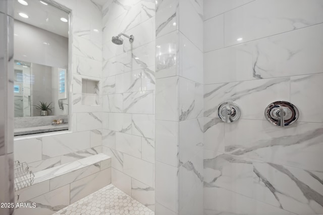 bathroom with tiled shower