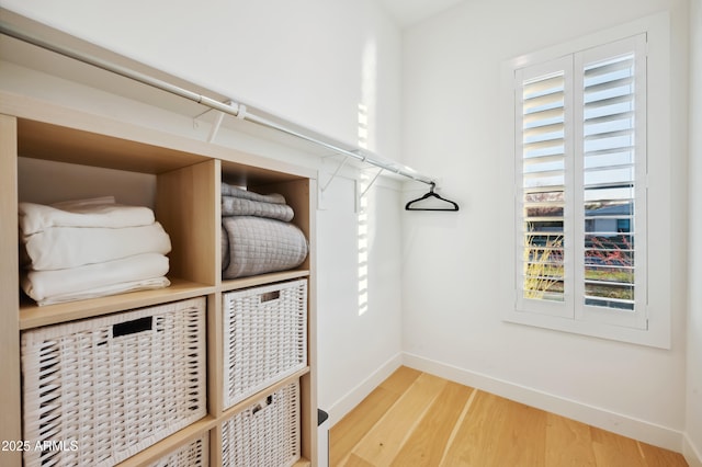 spacious closet featuring hardwood / wood-style floors