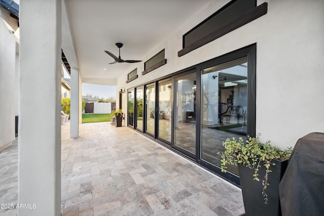 view of patio featuring ceiling fan