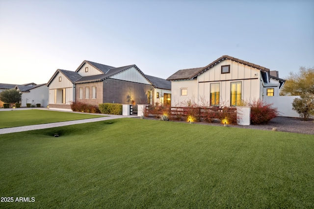 modern farmhouse featuring a front lawn