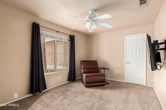 living area with visible vents, a ceiling fan, a healthy amount of sunlight, and carpet flooring