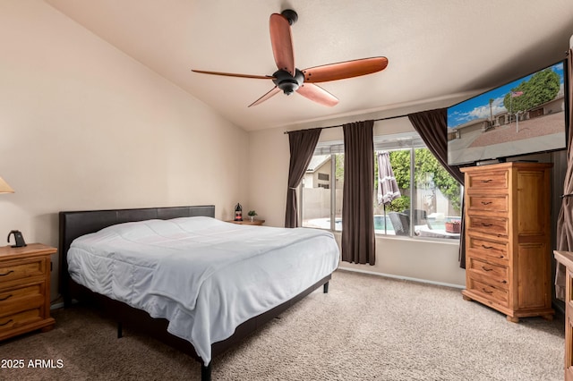 bedroom featuring ceiling fan, carpet flooring, and vaulted ceiling