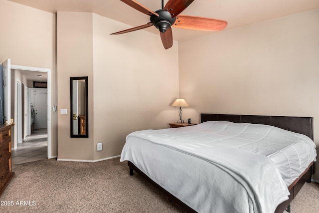 carpeted bedroom with baseboards and ceiling fan