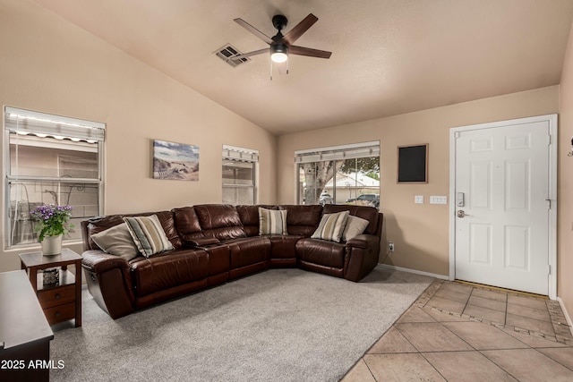 living area featuring visible vents, ceiling fan, lofted ceiling, light tile patterned floors, and light carpet