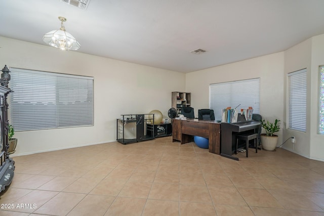 office featuring baseboards, visible vents, an inviting chandelier, and light tile patterned floors