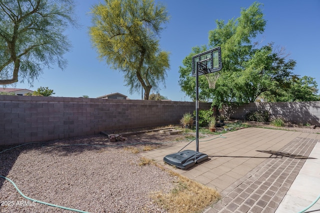 view of sport court featuring a fenced backyard