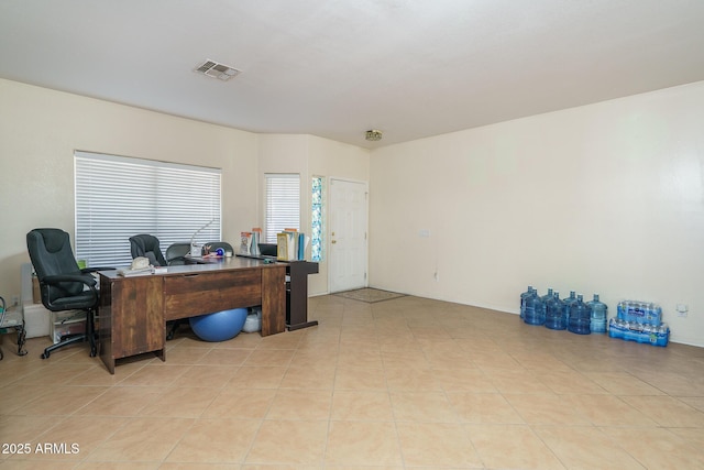 home office featuring light tile patterned flooring and visible vents