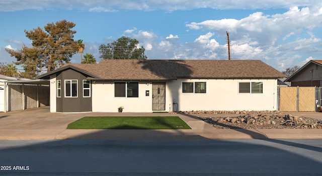 single story home with fence, driveway, a shingled roof, stucco siding, and a carport