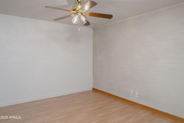 unfurnished room with light wood-style floors, baseboards, and ceiling fan