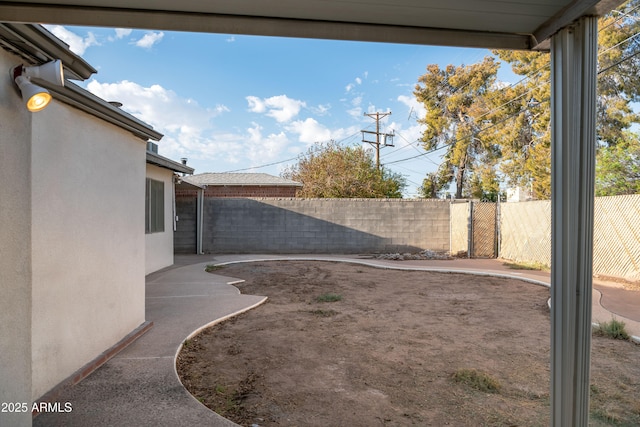 view of yard with a fenced backyard