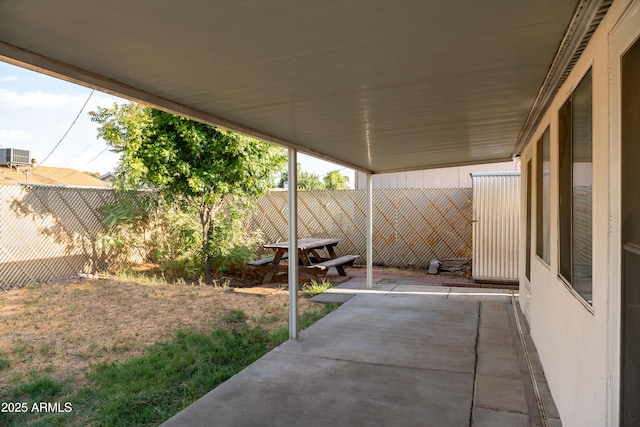 view of patio featuring fence