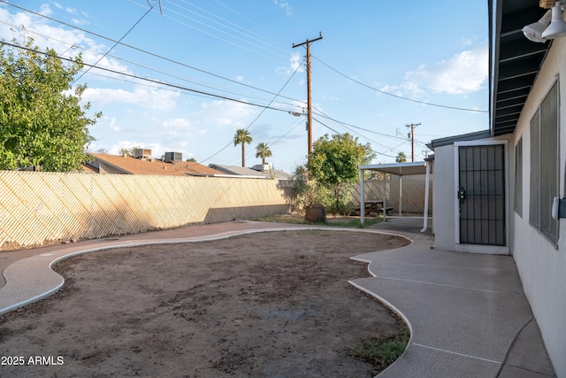 view of yard with a patio and a fenced backyard