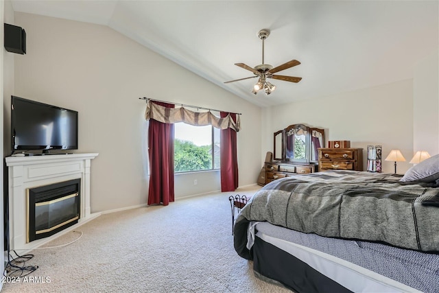 carpeted bedroom featuring vaulted ceiling and ceiling fan