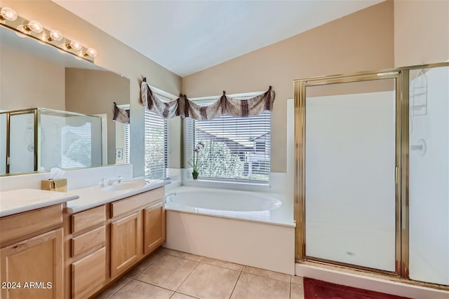 bathroom featuring plus walk in shower, tile flooring, dual vanity, and lofted ceiling