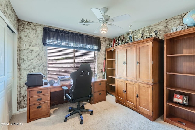 home office with light carpet and ceiling fan