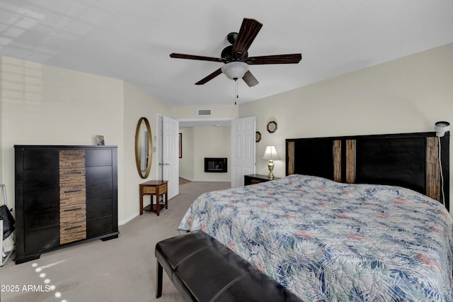 carpeted bedroom featuring ceiling fan