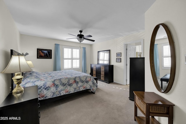 carpeted bedroom with ceiling fan