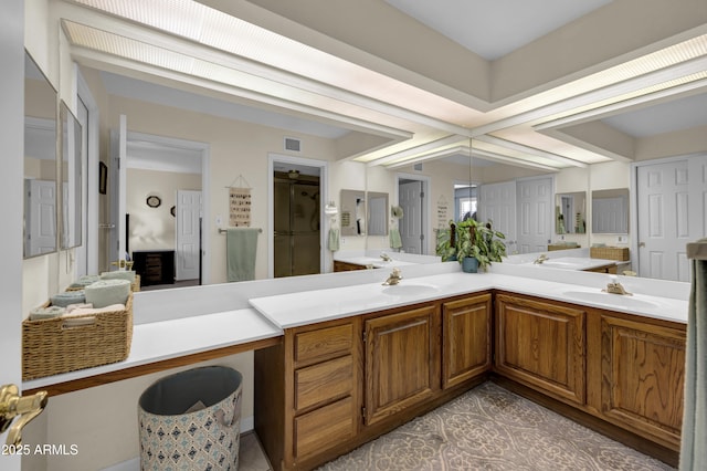 bathroom featuring tile patterned flooring and vanity