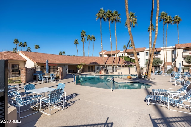 view of swimming pool with a patio area