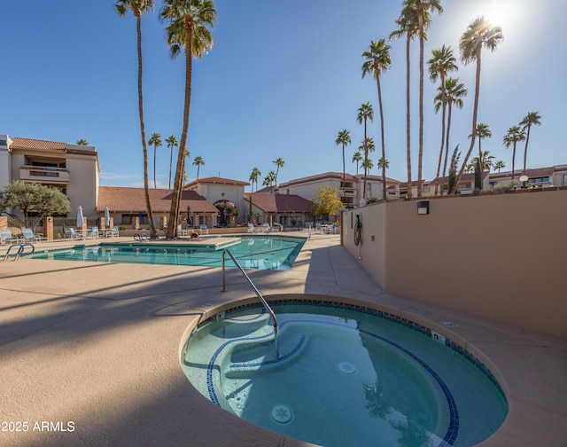 view of pool with a community hot tub