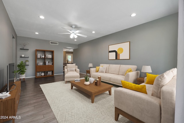 living room featuring ceiling fan and hardwood / wood-style floors