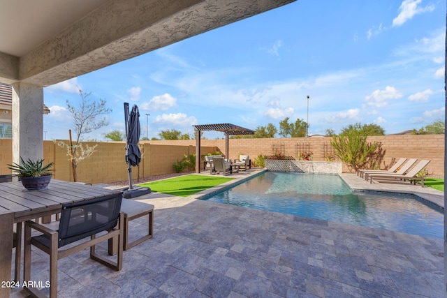 view of pool with a pergola, a patio area, and pool water feature