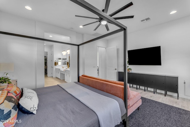 bedroom with light hardwood / wood-style floors, ceiling fan, and ensuite bathroom