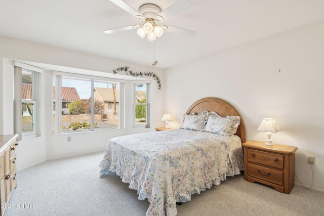 carpeted bedroom featuring a ceiling fan