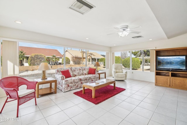 sunroom / solarium with ceiling fan and visible vents