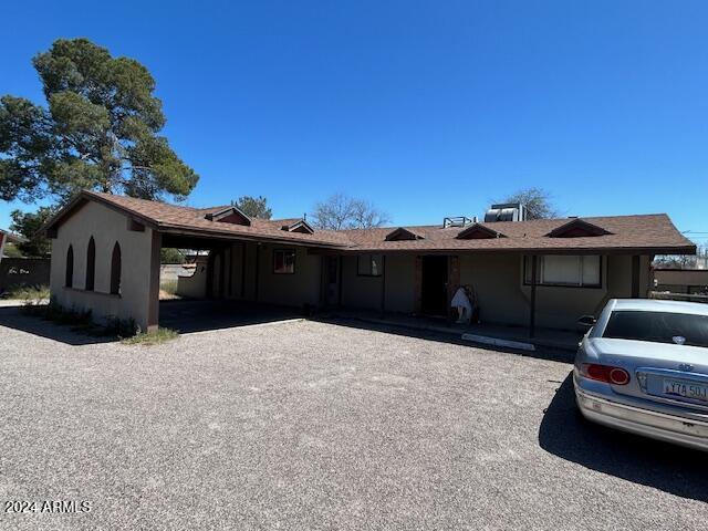 ranch-style house with a carport