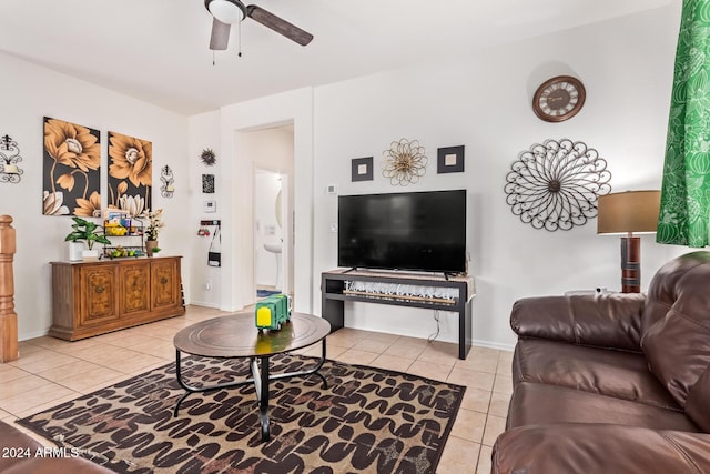 living room featuring ceiling fan and light tile patterned flooring