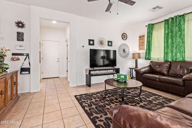 living room with ceiling fan and light tile patterned floors