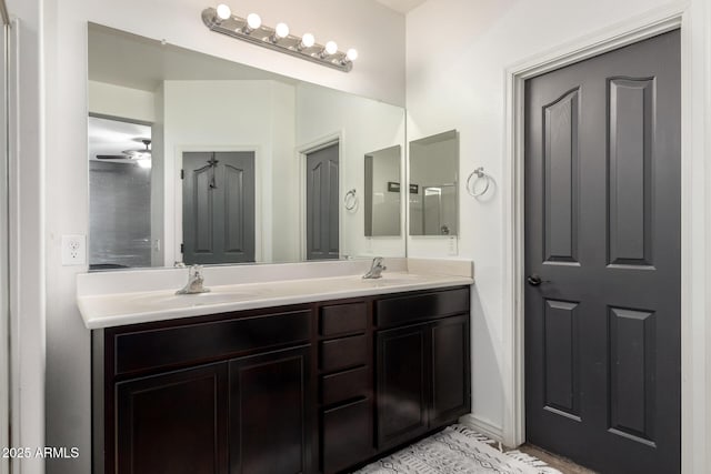 bathroom featuring ceiling fan and vanity