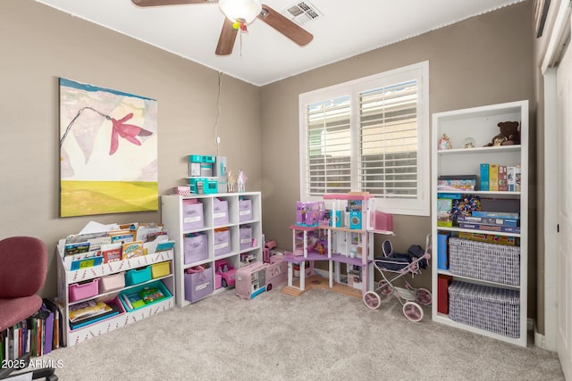 rec room with ceiling fan and carpet flooring