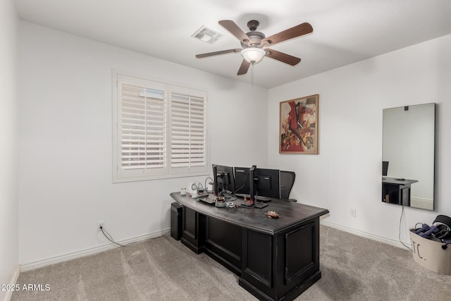 office space with ceiling fan and light carpet