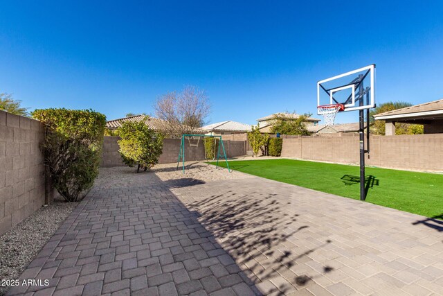 view of patio featuring a playground and basketball court