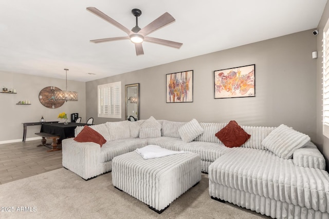 carpeted living room featuring ceiling fan and billiards