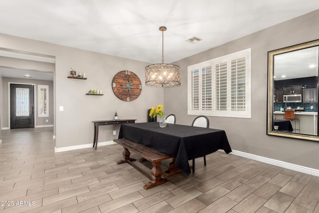 dining room featuring a notable chandelier