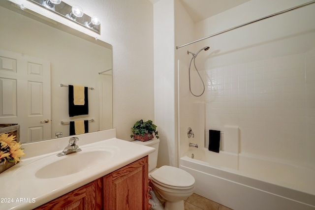 full bathroom featuring tile floors, vanity, toilet, and bathtub / shower combination